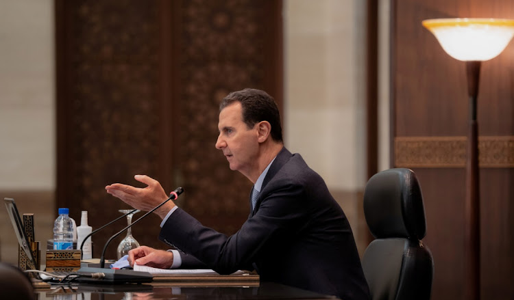 Syrian President Bashar al-Assad speaks at a cabinet meeting in Damascus, Syria, March 30 2021. Picture: SANA/REUTERS