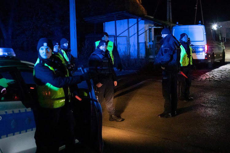 Police block a road, amid reports of two explosions, in Przewodow, Poland, November 15 2022. Picture: Jakub Orzechowski/Agencja Wyborcza.pl via REUTERS