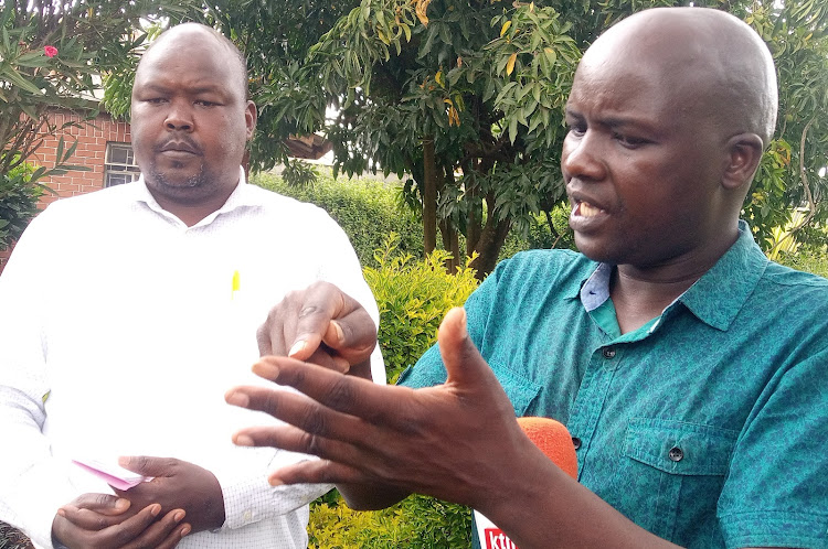 Uasu chapter chairman at University of Eldoret Phillip Chebunet (R) speaking in Eldoret on March 18.