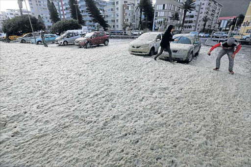 MARKED: The Sea Point promenade in Cape Town is sprayed with foam during the Cape storm Picture: ESA ALEXANDER