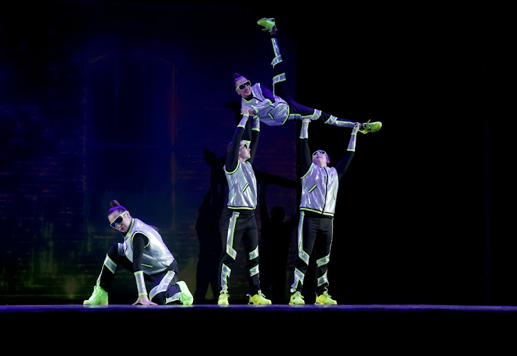 The group performing a hip-hop dance.