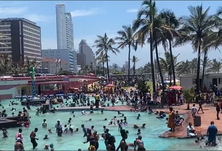 Hundreds of holiday makers enjoyed cooling off from the warm Durban sun on Friday in the pool and on the beaches.