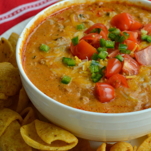 This six ingredient hot Chili Cheese Dip is always a hit with friends and family.  It takes less than 15 minutes to make on the stovetop and can easily be adapted to a crock pot.