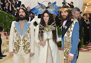 Alessandro Michele (left) with his muses.