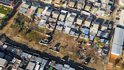 Plots are marked out and construction has begun as can be seen in this photograph of a park in Wallacedene, Cape Town, after a land invasion on Wednesday.