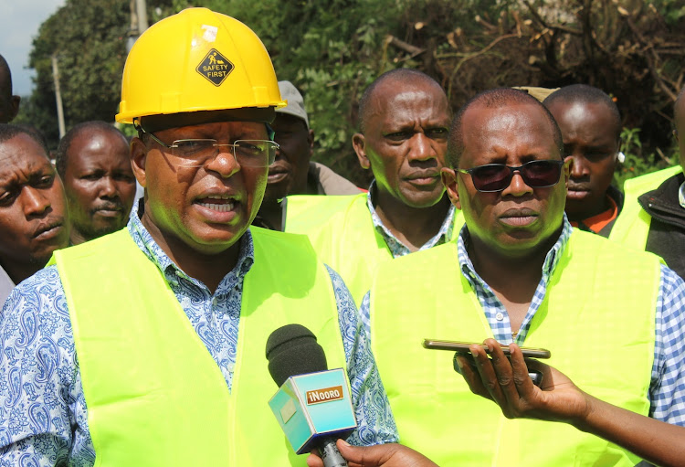 Othaya MP Gichuki Mugambi and his Mathioya counterpart Peter Kimari in Gichiche on Friday