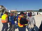 Protesters shut down the construction site of the new Nkululeko Secondary School on Tuesday afternoon claiming that only ANC members were employed to work on the site.  