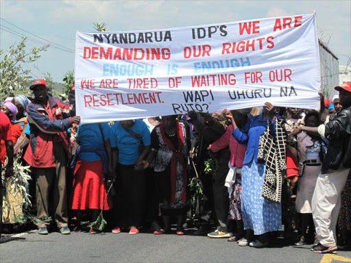 A section of over 2,000 integrated IDPs from Nyandarua County hold a demonstration along the Nairobi-Nakuru highway near the Gilgil weighbridge demanding compensation on Jan 13, 2016. /George Murage