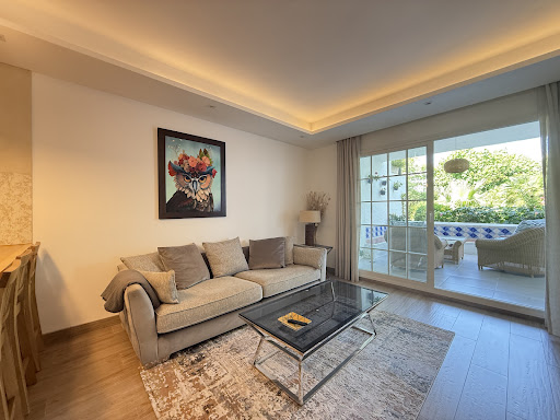 Modern living room with sofa and terrace access in this luxury apartment / penthouse for sale in Marbella ($2,817,805 - 150 m²)