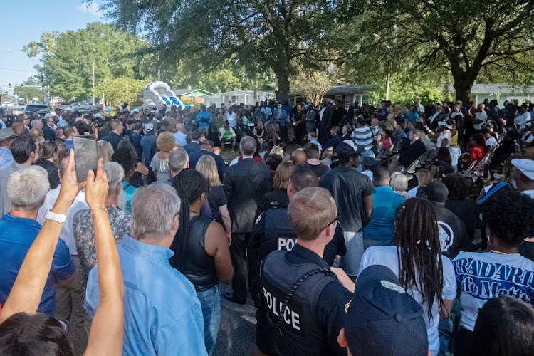 Mourners attend a prayer vigil a day after a white man armed with a high-powered rifle and a handgun killed three Black people at a Dollar General store before shooting himself, in what local law enforcement described as a racially motivated crime in Jacksonville, Florida, US August 27, 2023.