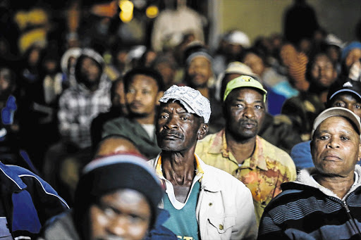 RISING UP: Strikers watch 'Miners Shot Down', the Rehad Desai documentary detailing the Marikana massacre