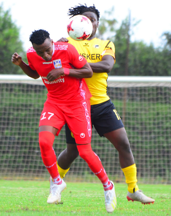 Bandari's Danson Chetambe contests for the ball with Hashim Sempala of Tusker during their Premier LEague clash at Utalii Sports Club.