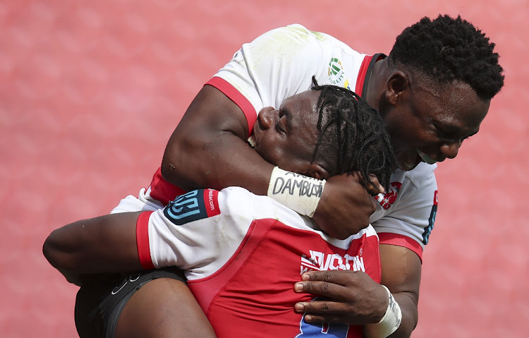 Emmanuel Tshituka of the Lions celebrates with Xamlashe Sango during the United Rugby Championship match against the Scarlets at Ellis Park in Johannesburg on December 4 2022.