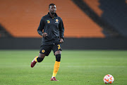 Kaizer Chiefs defender Eric Mathoho warms up before the the DStv Premiership match against TS Galaxy at Johannesburg's FNB Stadium on October 19 2022.