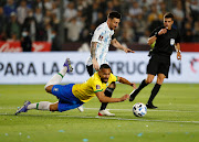 Argentina's Lionel Messi in action with Brazil's Matheus Cunha during a South American Fifa World Cup qualifying match  at the Estadio San Juan del Bicentenario, San Juan, in Argentina on November 16 2021.