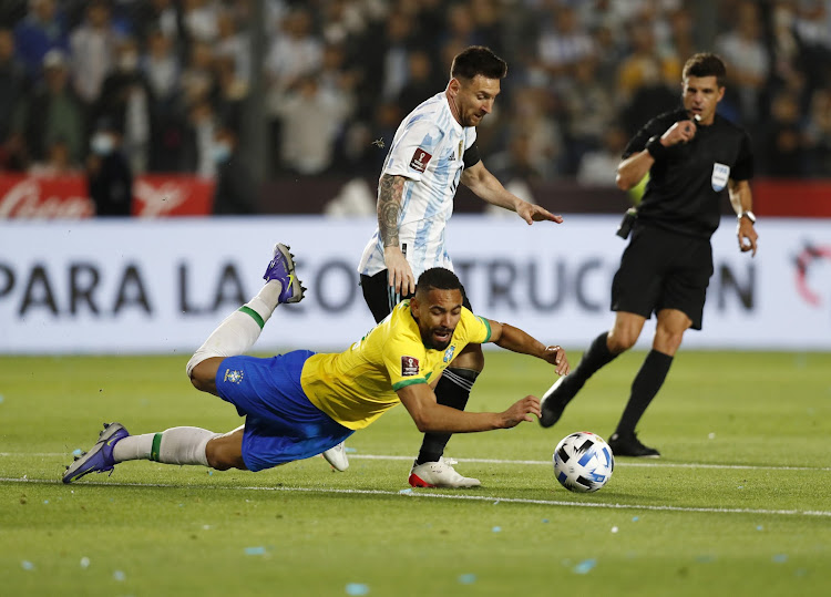 Argentina's Lionel Messi in action with Brazil's Matheus Cunha during a South American Fifa World Cup qualifying match at the Estadio San Juan del Bicentenario, San Juan, in Argentina on November 16 2021.