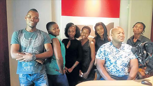 FEBRUARY 24;2017: TEAM: Sajonisi Youth Radio presenters Mathanda Mthotyelwa,Noncedo Nomveku,Khanya Mahlanza,Lusanda Madikane,Zimkhitha Qikane and Zimbini Mdolomba with the station's founder Simiso Shozi(seated behind a mic).Picture:SUPPLIED