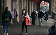 People wear face masks in the city centre as the state of New South Wales continues to report relatively low numbers for new daily cases of the coronavirus disease, in Sydney, Australia on September 4 2020. 
