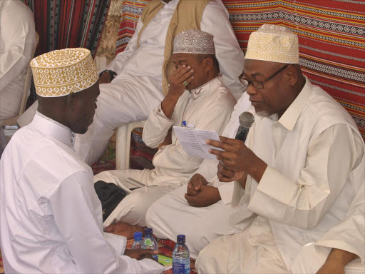 Muslim Clerics conduct NIkah to one of the 20 bridegroom during the mass wedding sponsored by an international NGO in Malindi at Tahdeeb Muslim Academy on December 9./ALPHONCE GARI