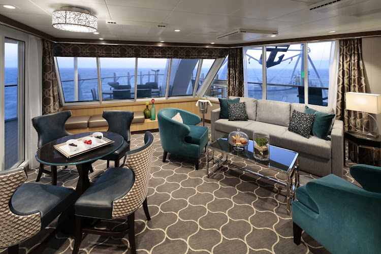  The living room of a sumptuous AquaTheater stateroom on deck 9 of Harmony of the Seas. 