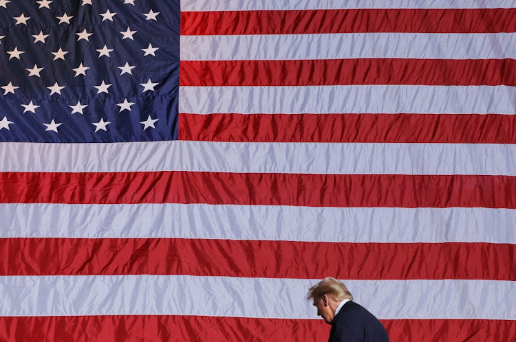 Republican presidential nominee and former US president Donald Trump walks on the day of a campaign rally in Greensboro, North Carolina, US, on November 2 2024. Picture: BRIAN SNYDER/REUTERS