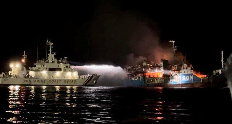 Philippine Coast Guard respond to the fire incident onboard M/V LADY MARY JOY 3 at the waters off Baluk-Baluk Island, Hadji Muhtamad, Basilan, Philippines, March 29, 2023.