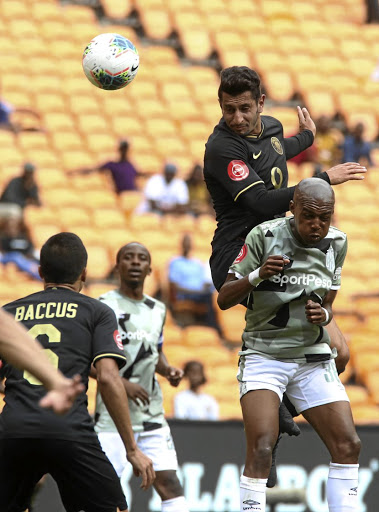 Kaizer Chiefs striker Leonardo Castro wins a header ahead of Cape Town City's Zukile Kewuti during their match at FNB Stadium yesterday. Chiefs won 3-0.