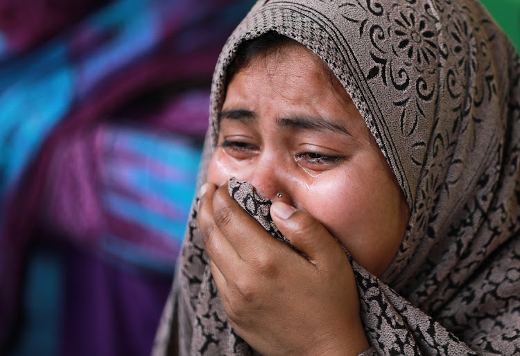 Rukhsar, a Muslim woman who fled her home along with her family after Hindu-Muslim clashes triggered by a new citizenship law, reacts as she takes shelter in a relief camp in New Delhi, India, on March 3 2020. Picture: REUTERS/ANUSHREE FADNAVIS