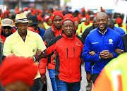 The relationship between Julius Malema's Economic Freedom Fighters, centre, and  Mmusi Maimane's Democratic Alliance is as good as a marriage of convenience.  