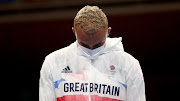 The dejected silver medallist Benjamin Whittaker of Britain during the medal ceremony.