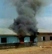 Fire rages at the Esokheni Secondary School near Greytown on Monday after pupils went on the rampage.