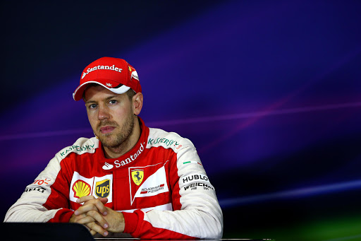 MELBOURNE, AUSTRALIA - MARCH 15: Sebastian Vettel of Germany and Ferrari attends the post-race press conference after the Australian Formula One Grand Prix at Albert Park on March 15, 2015 in Melbourne, Australia. (Photo by Mark Thompson/Getty Images)