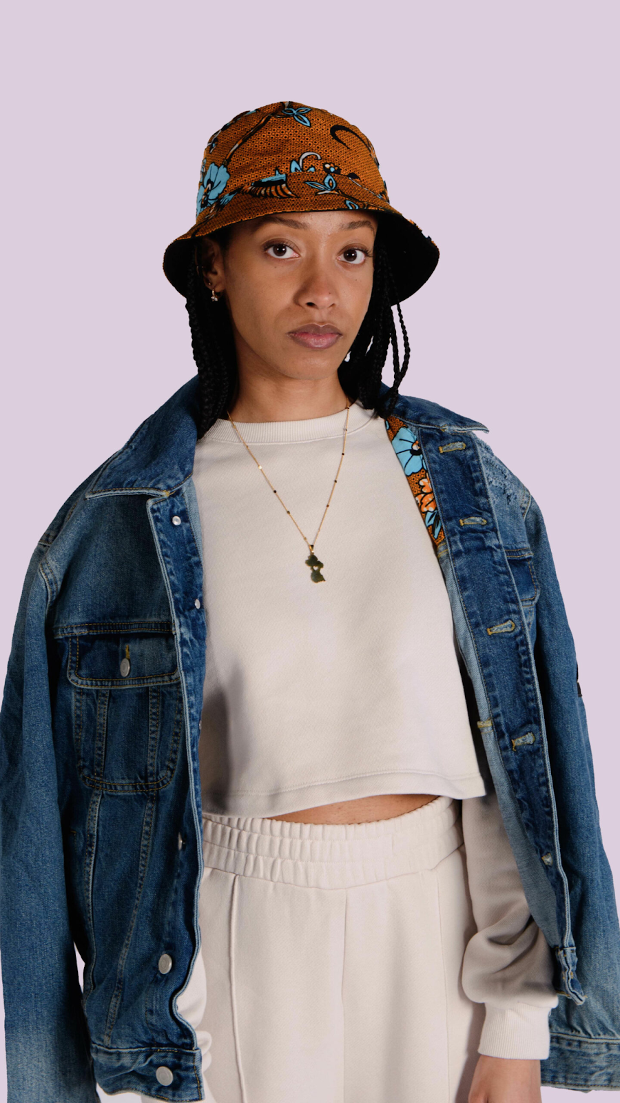 lady wearing ankara bucket hat with jean jacket 