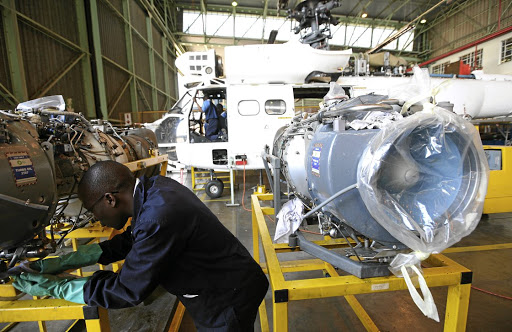 A mechanic works on an Oryx helicopter engine in a workshop hangar on the Denel Aviation site in Boksburg. Picture: KEVIN SUTHERLAND