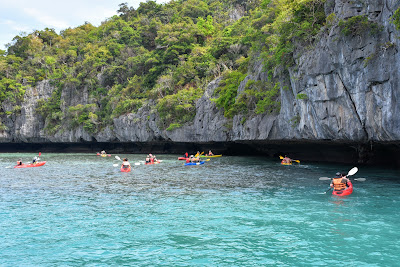 Paddle on a sit-on-top kayak around the island
