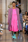 Enica Seshoka walks the runway during the Paul and Jone show at Paris Fashion Week.