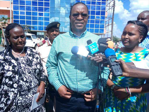 Samburu county women representative, Maison Leshoomo,Interior Principal Secretary Karanja Kibicho and Nominated Senator Naisula Lesuuda addressing the media in Maralal town. Photo/MARTIN FUNDI