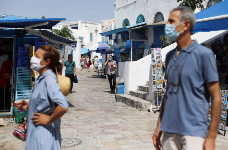 People wear face masks as they visit Sidi Bou Said, an attractive tourist destination, amid concerns about the spread of the coronavirus disease, near Tunis, Tunisia on July 30, 2021.