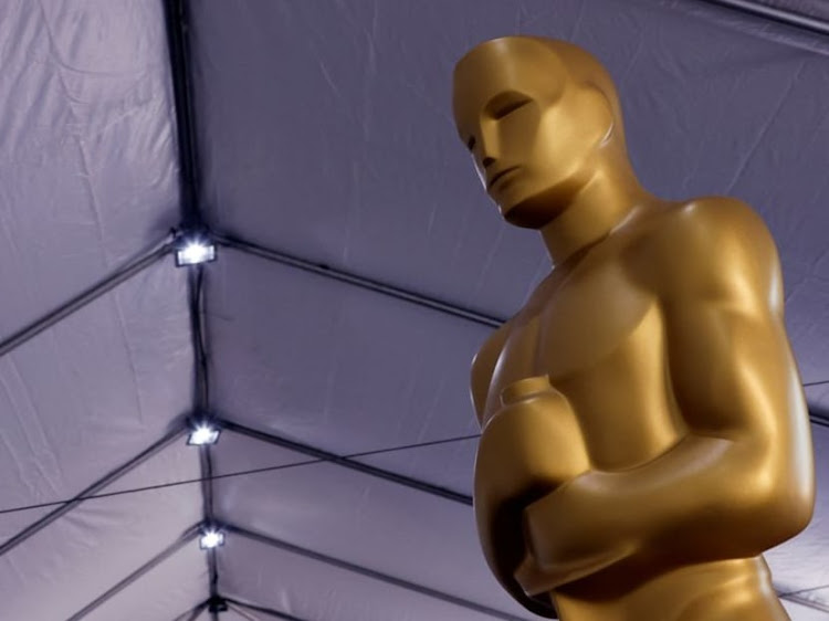 An Oscar statue sits before being placed out for display as preparations for the Academy Awards are underway in Los Angeles, California, U.S., March 24, 2022.