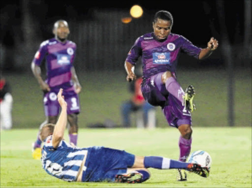 GOAL THREAT: SuperSport United's David Mathebula, right, is tackled by Maritzburg United's Michael Morton during their Absa Premiership match at Harry Gwala Stadium in Durban PHoto: Anesh Debiky/Gallo Images