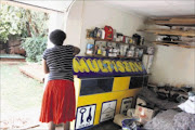 RAW DEAL: Multiserv apparently dumped equipment at the home of franchise owner Anna Radithalo after her lease agreement was not renewed by the company at Key West Mall, from which she operated. Pic.BAFANA MAHLANGU. 26/02/2010. © Sowetan.

20100226 BMA Multiserve frachise dumped their equipment at a clients home after a shopping mall where she operated did not renew the lease agreement. Her husband can not park his care in the garage. PHOTO: BAFANA MAHLANGU