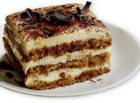 Tiramisu - slices of coffee, marsala, mascarpone cheese and cream - dusted with cocoa and sprinkled with chocolate curls