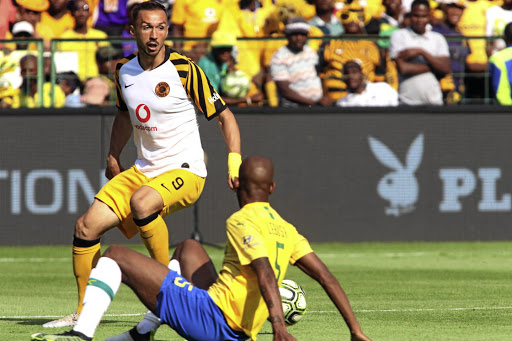 Kaizer Chiefs striker Samir Nurkovic dribbles past Mamelodi Sundowns' Mosa Lebusa during their Absa Premiership match at Loftus Stadium in Pretoria on Sunday. Chiefs won 2-0.