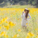 Girl in the yellow flower garden