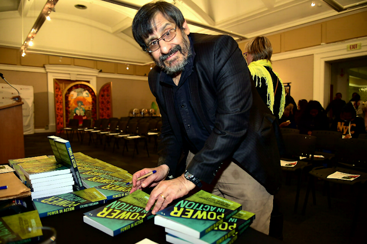 Author Steven Friedman signs copies of his book ‘Power in Action’ during its launch at the Nelson Mandela Art Museum 21 May 2019