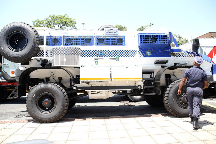 A Durban metro police officer looks at one of the four Casspirs bought by the eThekwini municipality. Abahlali says the ANC responds to their systemic exclusion and impoverishment with military force, 'using the same tools as the apartheid state'.