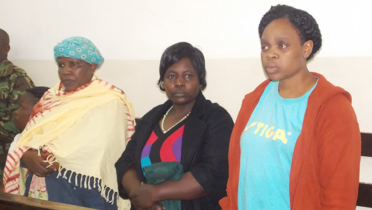 Eunice Shimuli, Joyce Musundi and Getrude Mutende in Kibera law courts on Thursday.