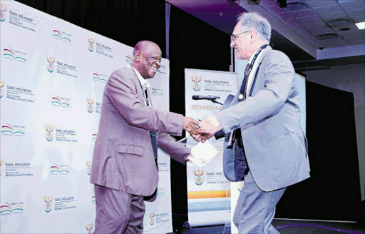 MEET AND GREET: MEC for Education Mandla Makupula welcomes Deputy Minister Enver Surty at a business breakfast at Hemingways Picture: SISIPHO ZAMXAKA