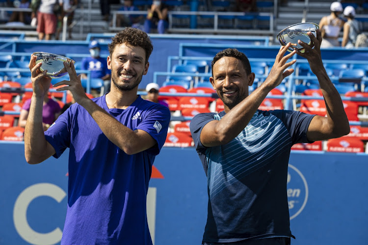 Ben McLachlan of Japan and SA’s Raven Klaasen celebrate winning the doubles final against Neal Skupski of Britain and Michael Venus of New Zealand at the Citi Open at Rock Creek Park Tennis Center, in Washington, US, on Sunday