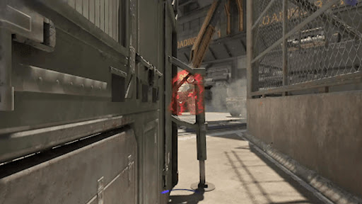 Move towards the loading entrance while hiding behind obstacles